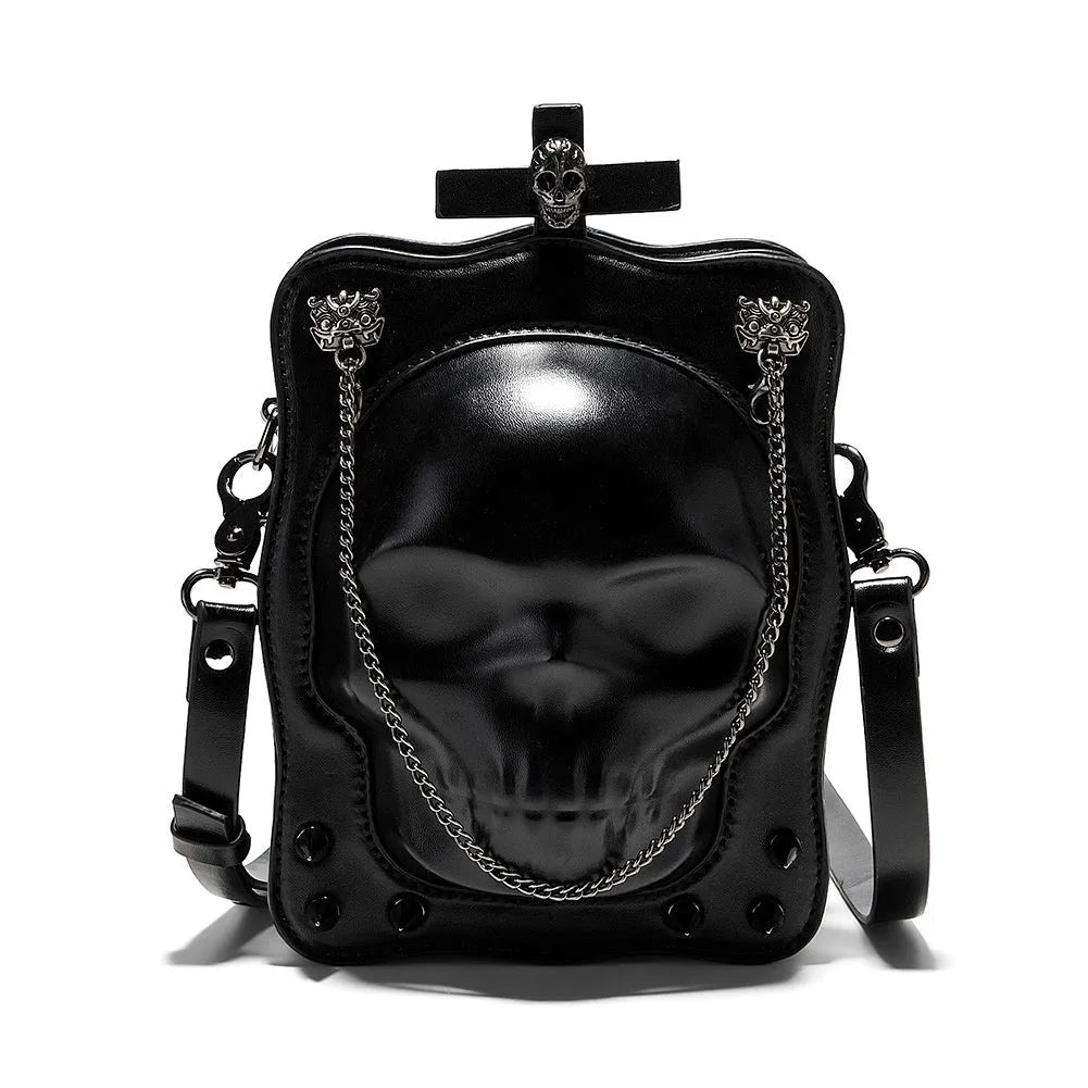 Black mini square messenger bag with embossed skull design, metal chains, and crossbody strap