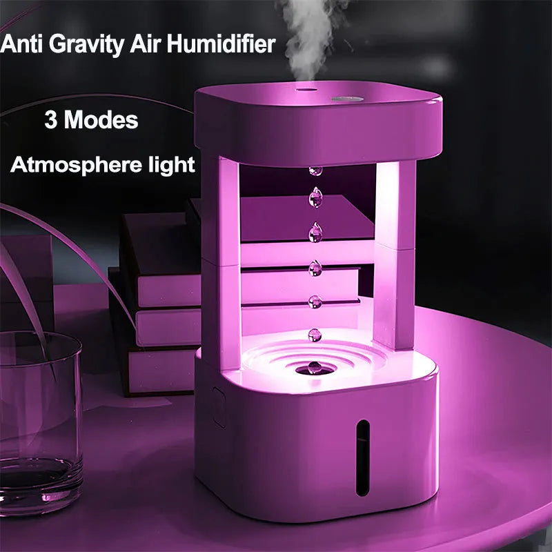 Creative anti-gravity water drop humidifier with upward flowing droplets and coloured lights