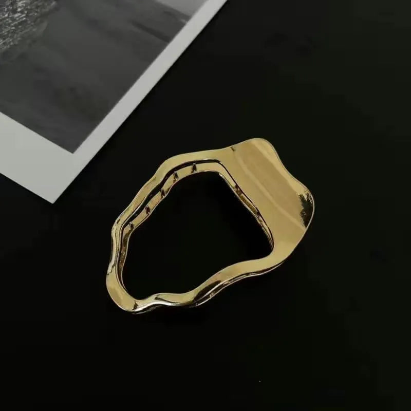 Women's gold and silver zinc alloy hair barrettes in arc, square, and triangle shapes.