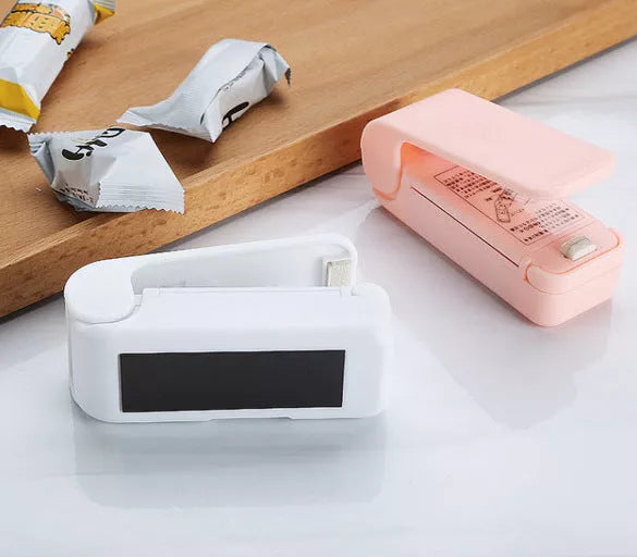 Home Portable Mini Sealing Machine in white and pink with optional magnetic closure