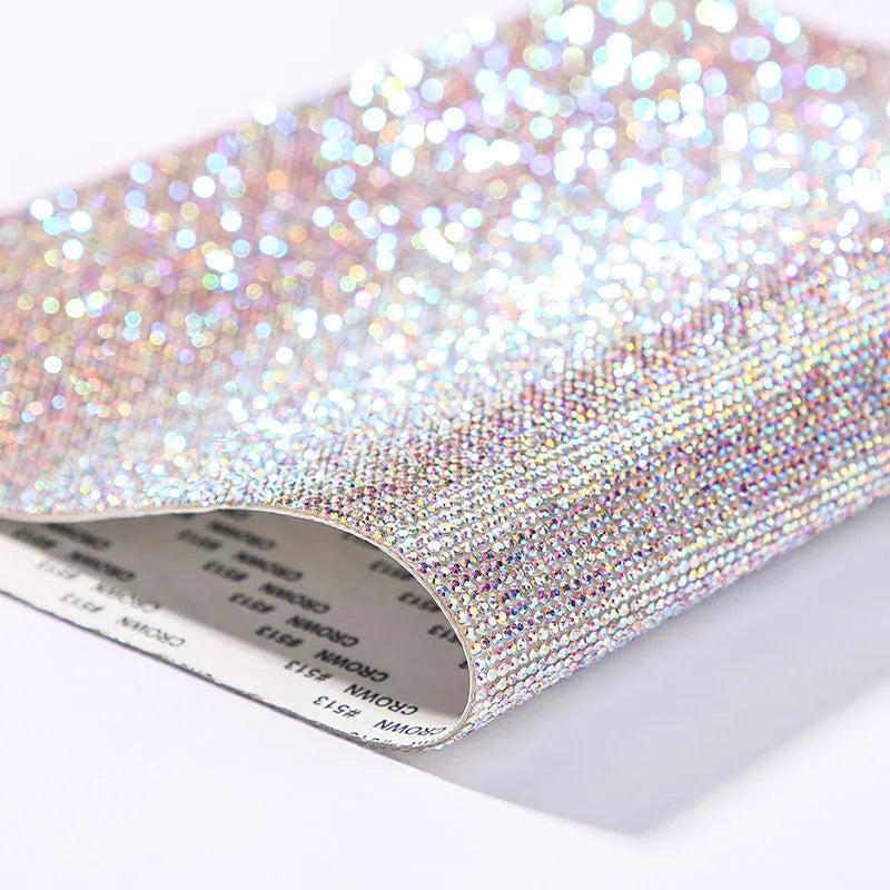 Rhinestone sticker net on backing sheet for hot drilling application to fabrics in multiple colour options