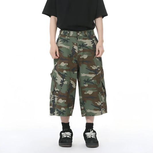 Men's camouflage pattern cotton jeans with wide-leg loose fit and cropped length, showing large side pockets