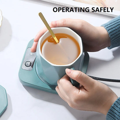 Electric tea water heating pad on desk with coffee cup, keeping beverage warm