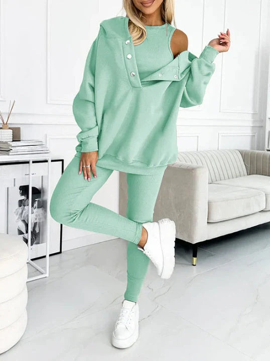 Women's 3-piece sports suit featuring a hooded sweatshirt with pockets and slim trousers