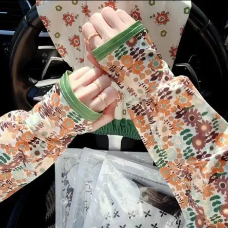 UV protection ice silk oversleeves in floral pattern covering forearm and elbow