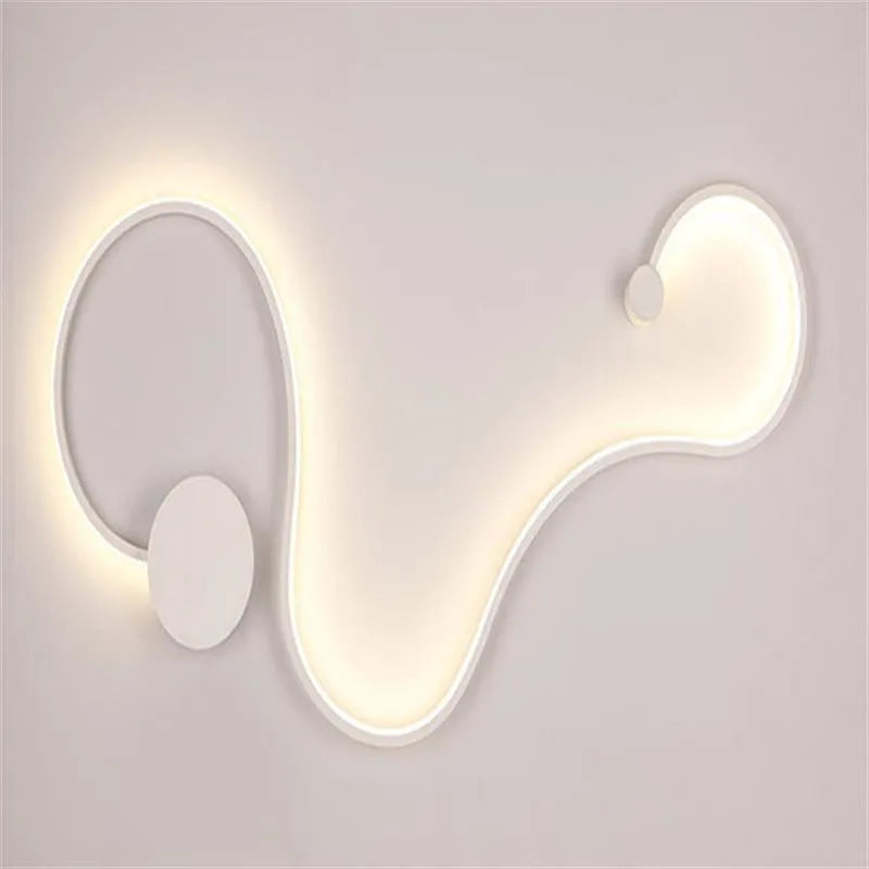 Modern black and white LED wall lamp with aluminium shade in four different sizes for bedside or corridor lighting