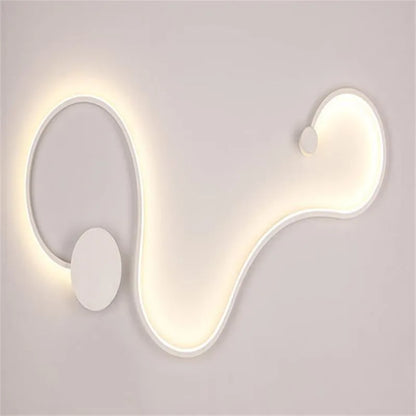 Modern black and white LED wall lamp with aluminium shade in four different sizes for bedside or corridor lighting