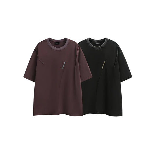 Purple washed cotton T-shirt with embroidery, loose fit, shown on a hanger.