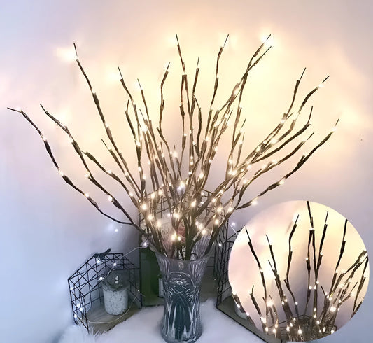 Silver branch LED tree light in a vase with multiple colour change modes including blue, pink, and warm white.