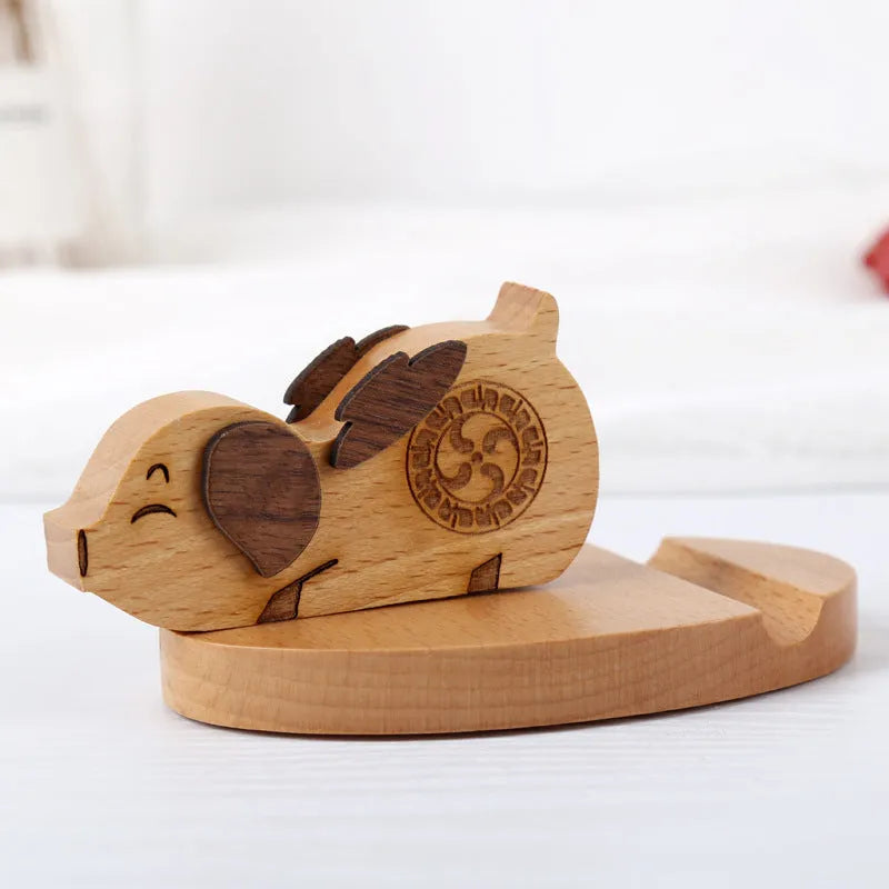 Beech wood mobile phone holder with coin slot showing adjustable angle and resin decorative elements