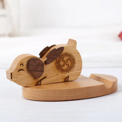 Beech wood mobile phone holder with coin slot showing adjustable angle and resin decorative elements