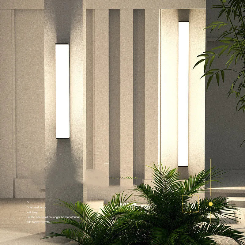 60cm long outdoor wall light with stainless steel housing and LED strip illumination for exterior spaces