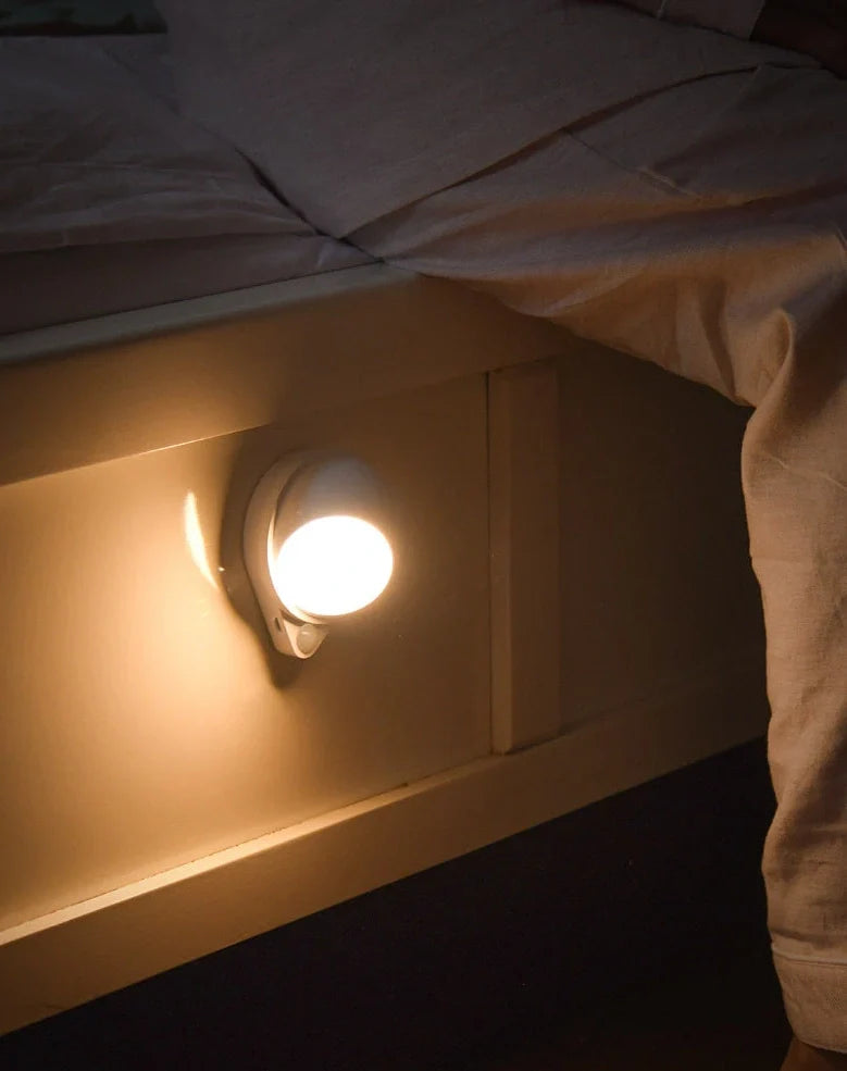 Wireless motion sensor light with USB charging port and adhesive mounting for wall installation