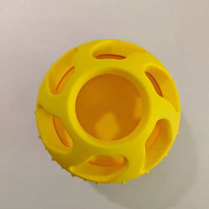 Yellow silicone pet slow feed ball with dental cleaning grooves and removable snack mold accessory
