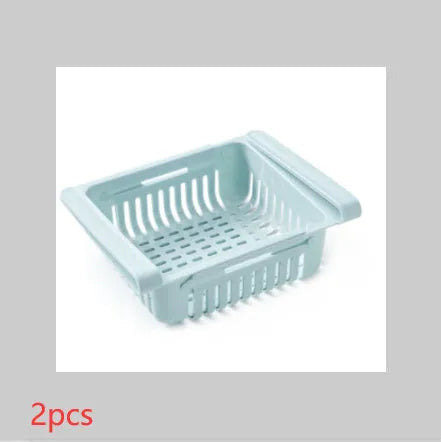 Plastic telescopic refrigerator storage basket in apricot colour, showing multiple compartments for organisation.