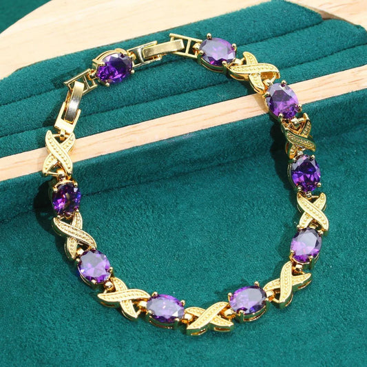 18k gold plated jewellery set with multi-colour synthetic cubic zirconia stones, including necklace, earrings, ring, and bracelet