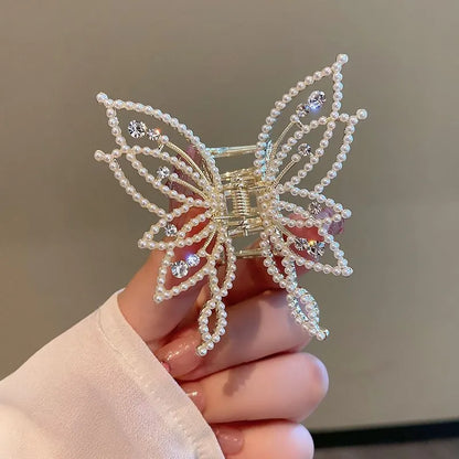 Butterfly-shaped alloy hair clip for women, available in rhinestone or pearl style.
