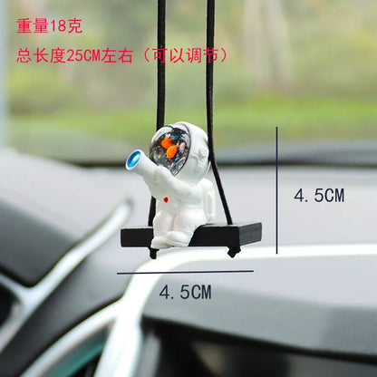 Colourful resin astronaut car pendant ornament with cartoon spaceman design on car dashboard