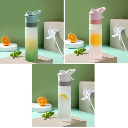 Large plastic spray water bottle with handle strap and leakproof lid in green colour.