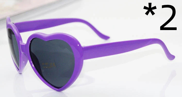 Stylish heart-shaped lighting sunglasses with a plastic frame and resin lenses, creating a mesmerizing effect for romantic occasions