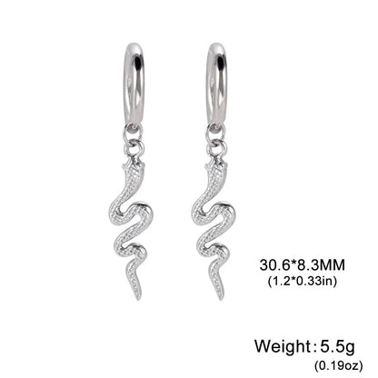Gold coloured snake-shaped vintage clip-on earrings made from stainless steel.