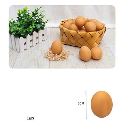 Pink rubber simulation egg dog toy with a textured surface for chewing.