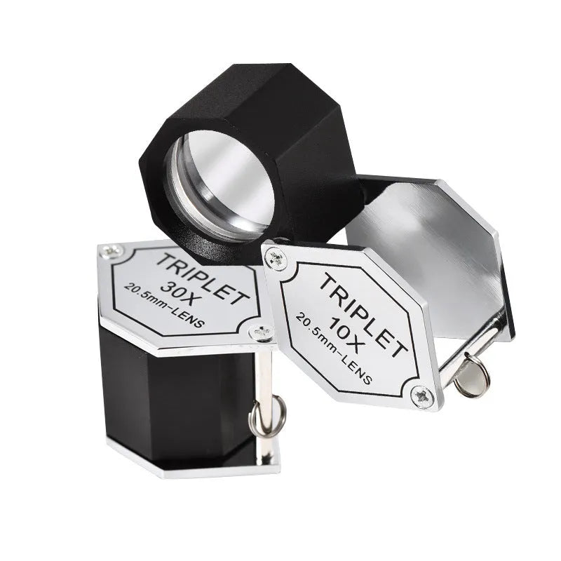 Handheld metal and optical glass magnifying glass for jewellery, stamp, and coin identification with 10x to 30x magnification.