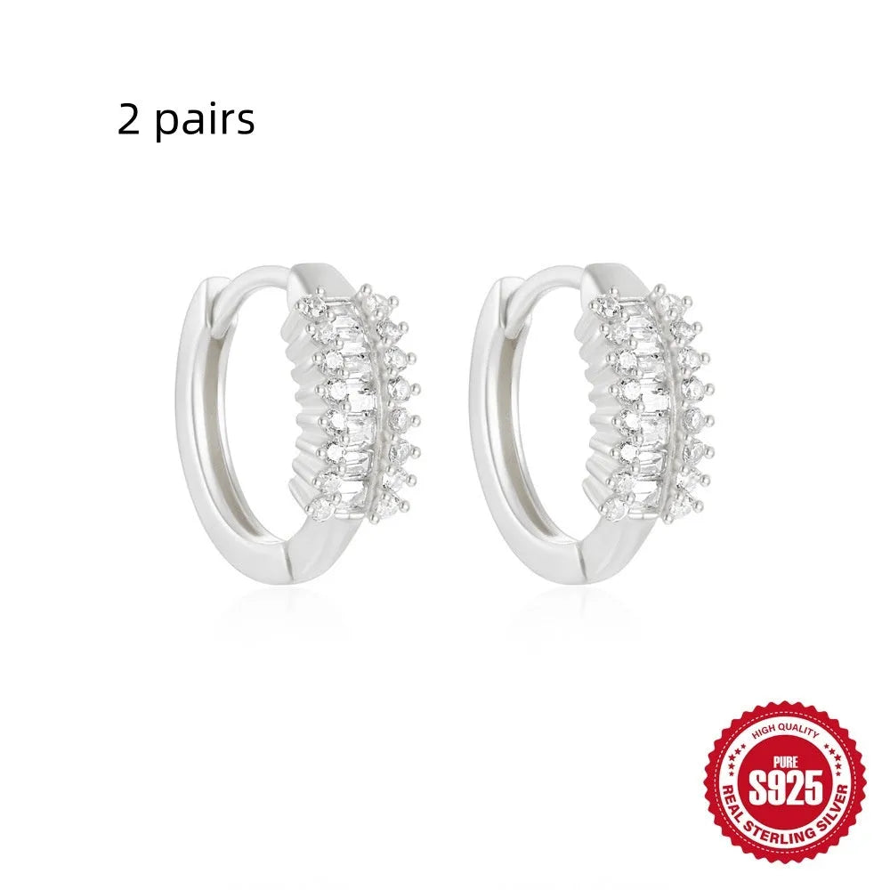 Sterling silver geometric stud earrings with small round diamond accents in gold or silver finish