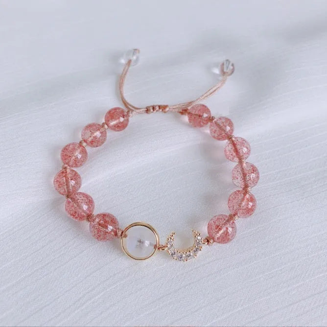 Handcrafted strawberry quartz crystal bracelet with adjustable string closure and Hetian jade peach blossom design