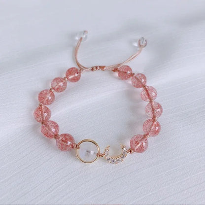 Handcrafted strawberry quartz crystal bracelet with adjustable string closure and Hetian jade peach blossom design