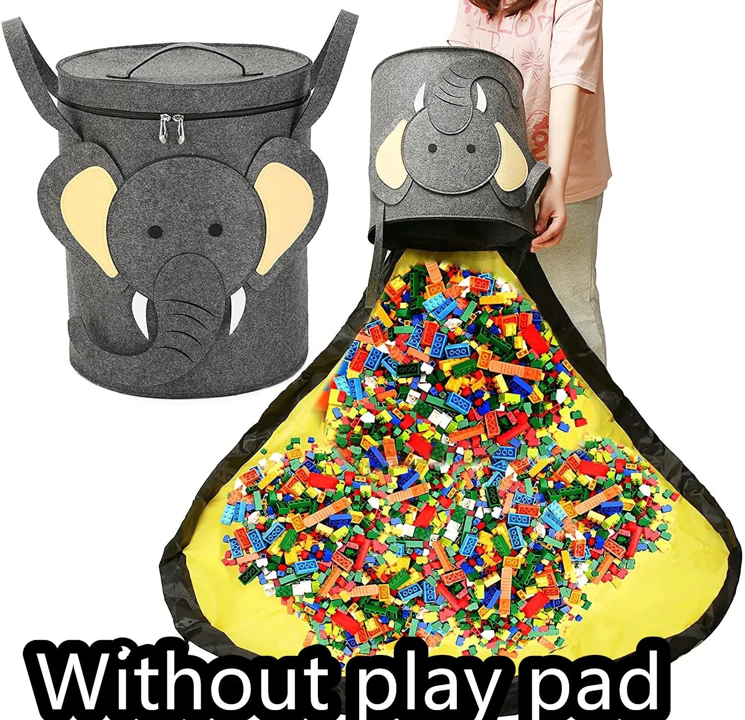 Green felt storage cube with pull rope unfolded into a large square play mat on a wooden floor.