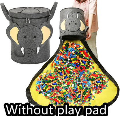 Green felt storage cube with pull rope unfolded into a large square play mat on a wooden floor.