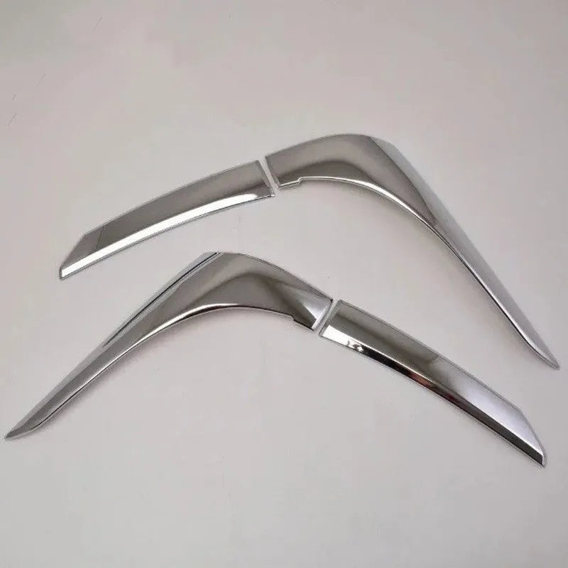 Set of four silver electroplated tail light eyebrow trims for Mitsubishi Outlander on white background.