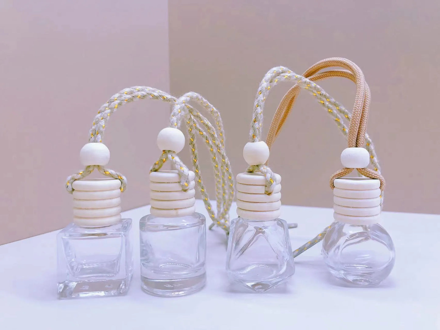 Car perfume pendant in four glass bottle styles: cylinder, diamond, flat drum, and square
