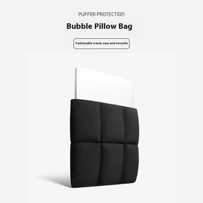 Soft black polyester laptop sleeve for a 15.6-inch laptop on a table.