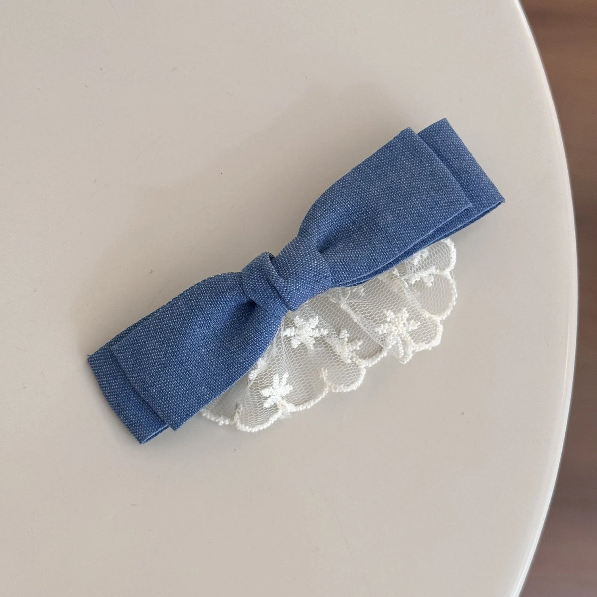 Cloth barrette hairpin set showing blue bow, beige lace, and pearl butterfly designs