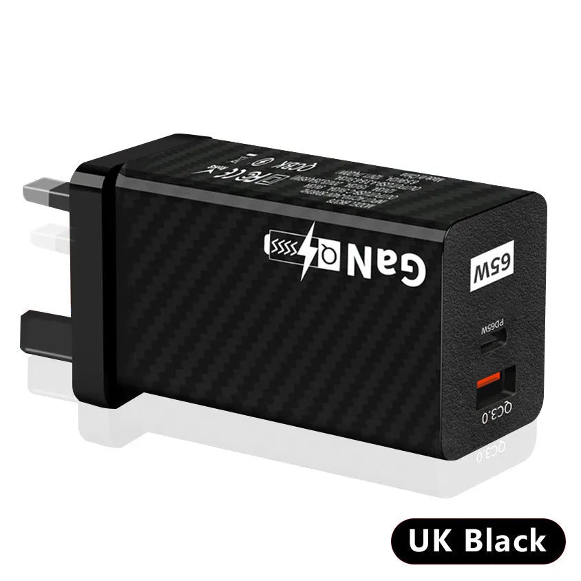 White or black GaN 65W universal laptop charger with USB-C port and compact design next to EU and US plugs