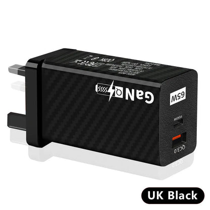 White or black GaN 65W universal laptop charger with USB-C port and compact design next to EU and US plugs