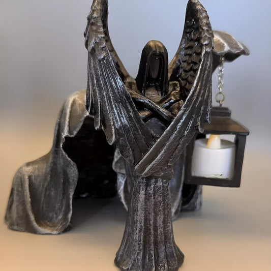 Dark Angel resin statue ornament measuring 6.5 by 5 by 17 centimetres on a wooden surface.