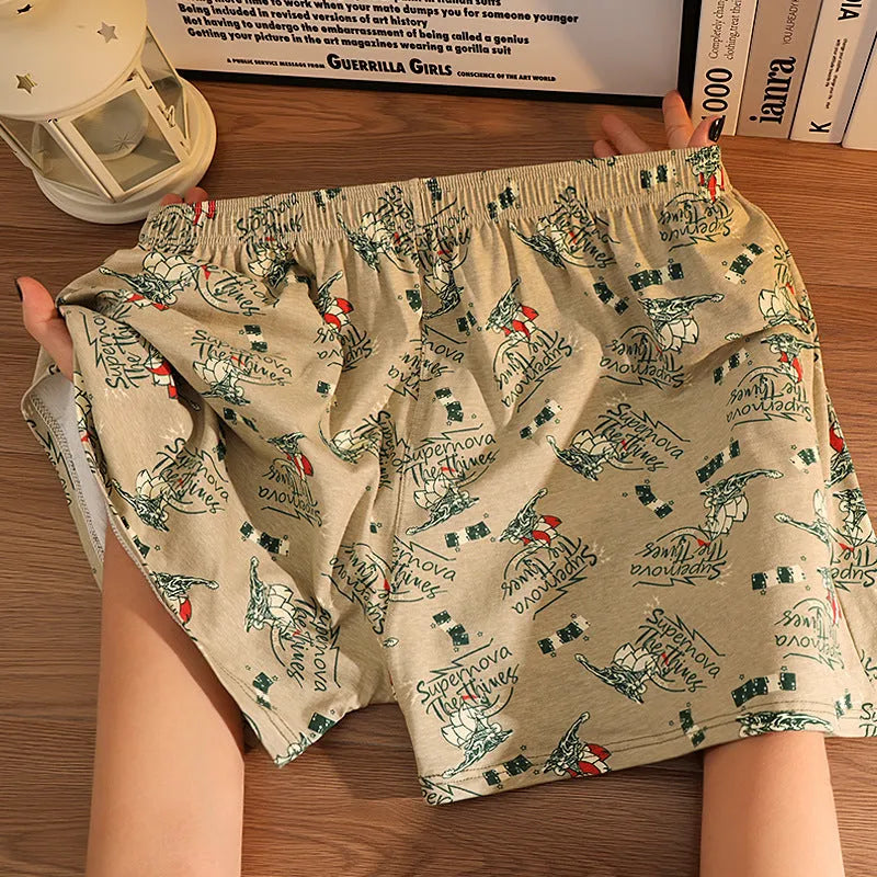 Men's grey printed cotton boxer shorts with mid waist and loose casual fit laid flat.