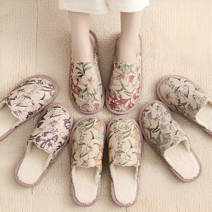 Pair of floral cotton slippers with linen-texture upper and light PVC sole for home wear.