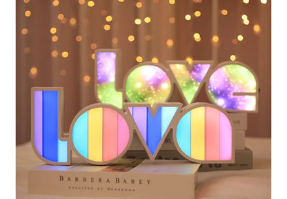 Rainbow halo LED love light with 'LOVE' word decoration on plastic casing.
