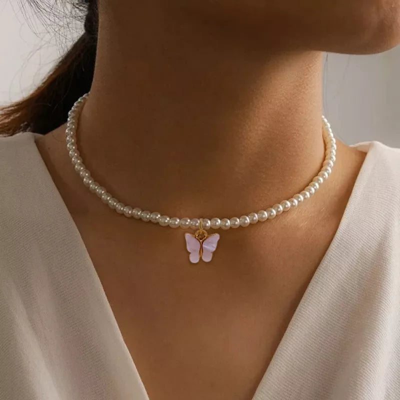 Elegant white pearl choker necklace with butterfly charm for women