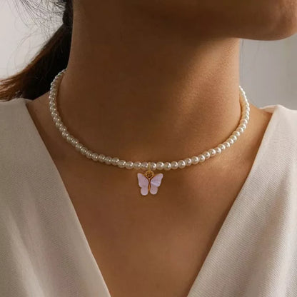 Elegant white pearl choker necklace with butterfly charm for women