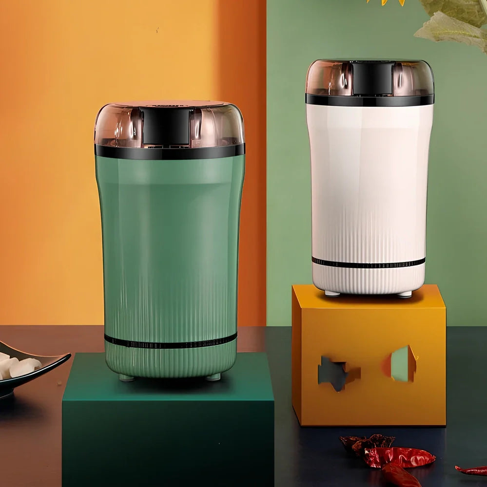 Small household grinder in green or white colour with 120g capacity for milling grains and coffee beans