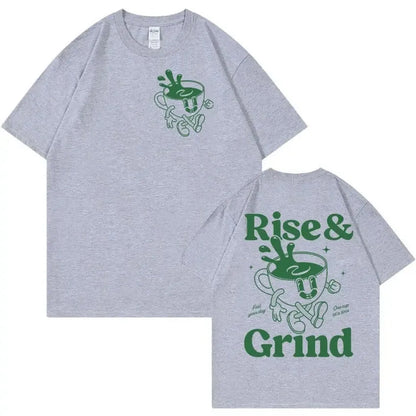 Man wearing a loose linen t-shirt with a printed Rise And Grind Green Coffee cartoon illustration.