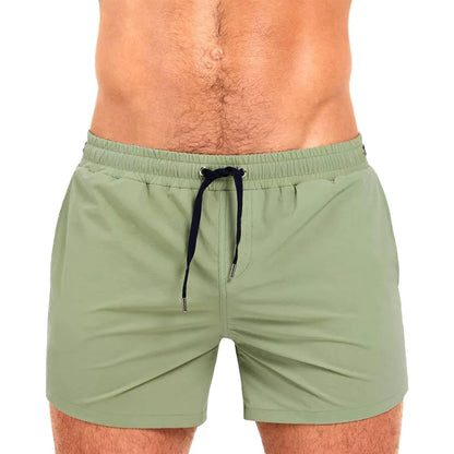 Athletic sports shorts in Army Green colour with visible mesh lining and elastic waistband with drawcord.