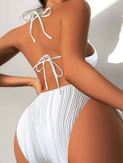 Women's black triangle bikini with white lace-up ties on the top