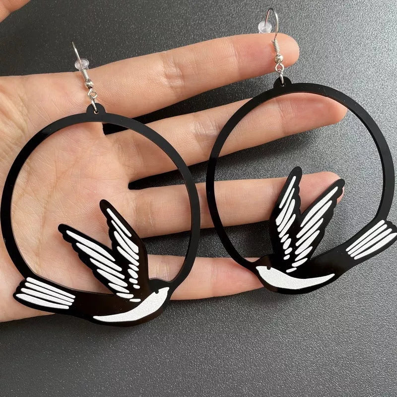 Black acrylic dangle earrings featuring unique animal and zodiac designs, lightweight and stylish.