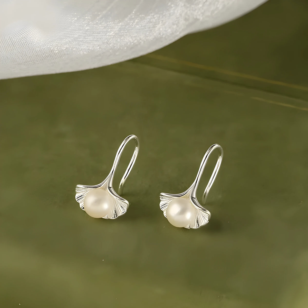 Silver ginkgo leaf ear hooks for women with pearl detail, copper electroplated flower-shaped earrings, one pair